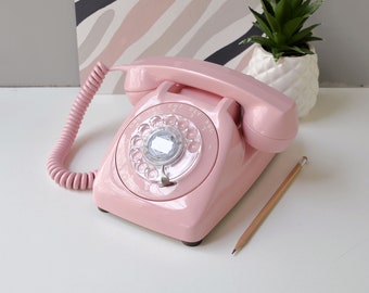 Pink rotary dial phone by Automatic Electric, restored and working