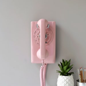 Pink rotary dial wall phone restored and working