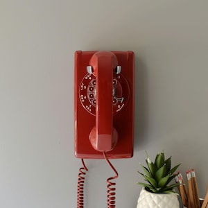 Red rotary dial wall phone restored and working
