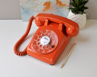 Vintage rotary phone restored and working, rotary dial desk phone in orange