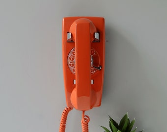Orange rotary dial wall phone, restored and working