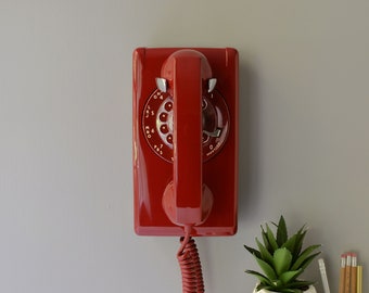 Red rotary dial wall phone restored and working