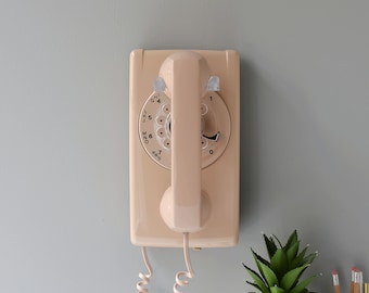 Rotary dial wall phone in buff beige, restored and working