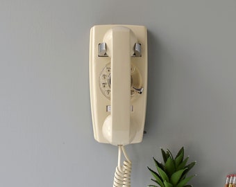 Beige rotary dial wall phone, restored and working