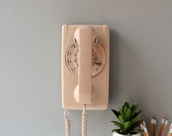 Rotary dial wall phone in buff beige, restored and working