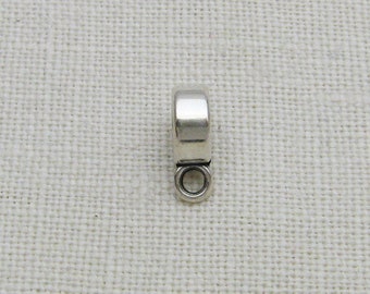 May include: Silver-toned metal pendant bail with a round loop at the bottom. The bail is designed to attach a pendant to a chain or cord.