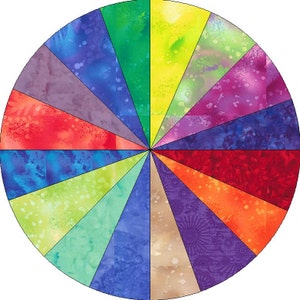 Könnte beinhalten: Ein bunter Stoffkreis mit 16 verschiedenen Stoffstücken, die in einem Kreis angeordnet sind. Jedes Stück hat eine andere Farbe und ein anderes Muster, darunter Rot, Orange, Gelb, Grün, Blau, Lila und Braun.