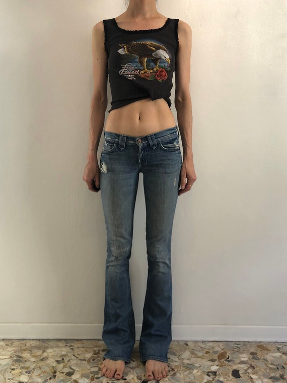 Low waisted raw hem embroidered western style jean