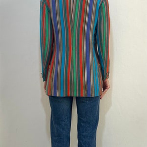 May include: A striped blazer with a variety of colors, including red, blue, green, and yellow. The blazer is made of a lightweight fabric and has a relaxed fit.