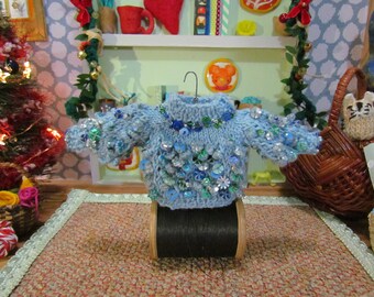 Decoração de mini suéter de sereia com lantejoulas