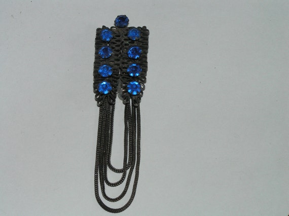 A Vintage Blue and Black Clothing Clip - image 5