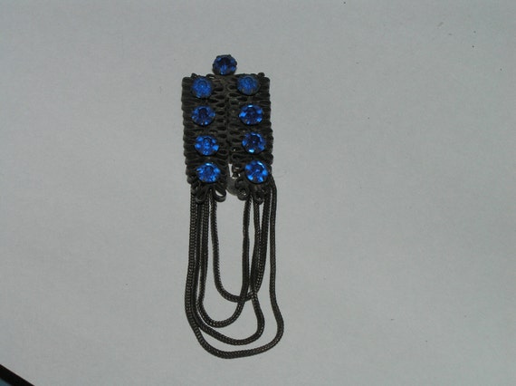 A Vintage Blue and Black Clothing Clip - image 1