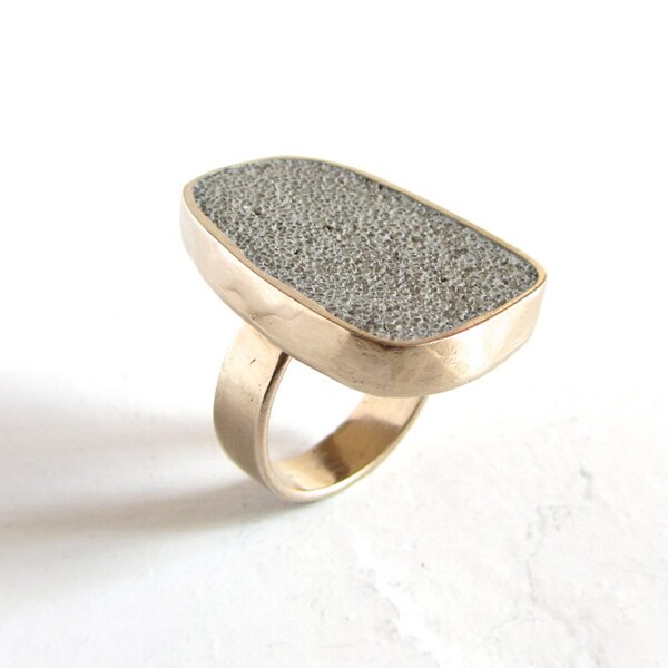 Big bronze and concrete statement ring