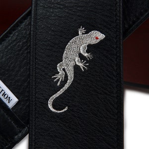 Simply Classy Black Leather Guitar Strap embroidered with a Silver Gecko