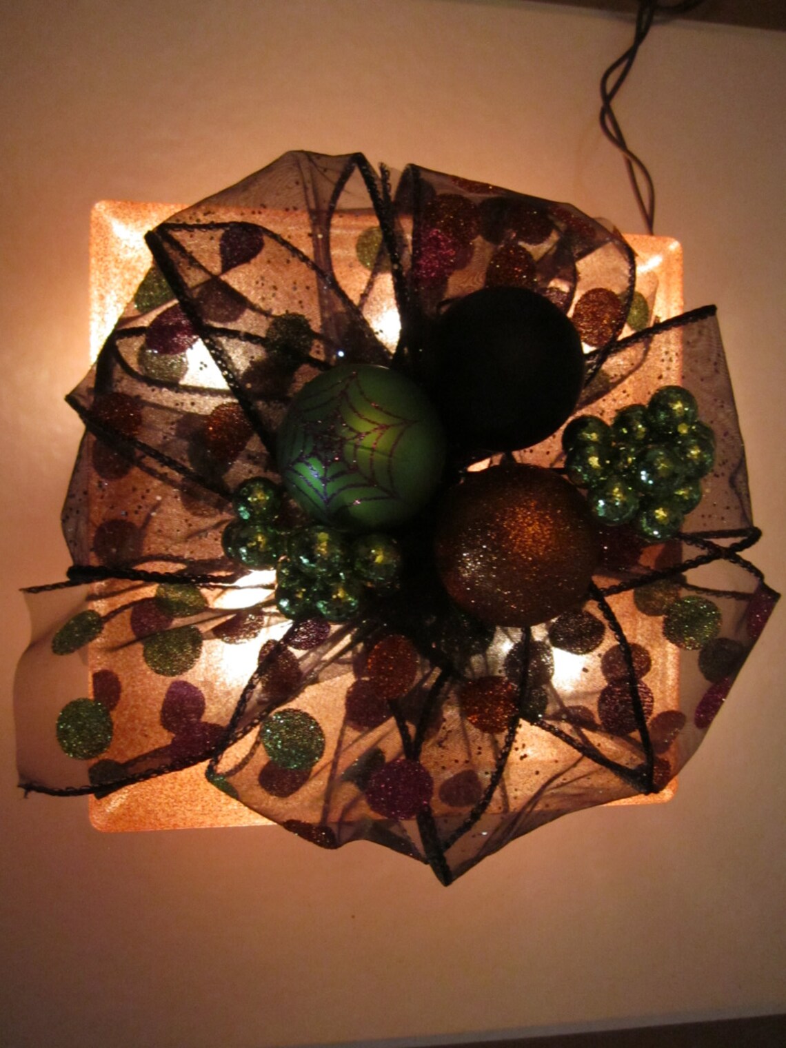 Orange Decorative Glass Block With White Lights Covered in Colorful