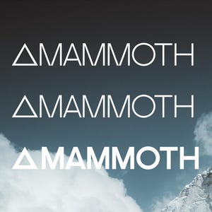 May include: Three instances of the word "MAMMOTH" in a sans-serif font are displayed against a backdrop of a mountain and cloudy sky. The word is white, with a triangle replacing the letter "A". The image is a typeface specimen.