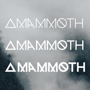 May include: Three instances of the word "AMAMMOTH" in white, sans-serif font, are stacked vertically against a misty, mountainous backdrop. The word is stylized with a triangle at the beginning and a circle with a line through it at the end.