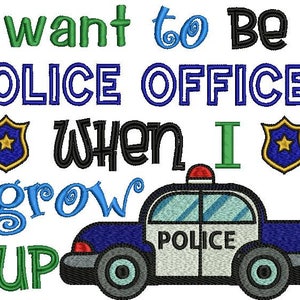 May include: An embroidery design featuring the text I want to Be a POLICE OFFICER WHEN I grow UP in blue, green, and black thread. Two yellow and blue police badges flank the text, and a blue and white police car with a red light is included.