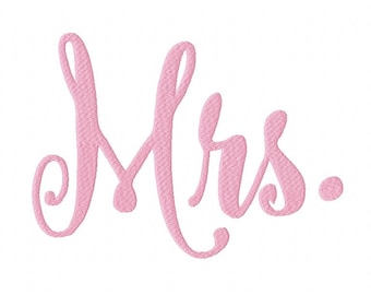 May include: The word Mrs. is rendered in a light pink, cursive-style embroidery font. The letters feature a textured, stitched appearance with visible thread patterns throughout the script, creating a raised and detailed look for the text.