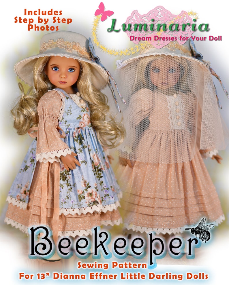 May include: Two dolls in handmade dresses and hats. One doll wears a blue floral dress and matching hat. The other doll is in a peach dress with a veil. The image includes the text "Beekeeper Sewing Pattern" and "For 33 cm Dianna Effner Little Darling Dolls."