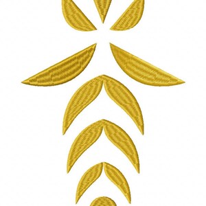 May include: A golden yellow embroidery design featuring a vertical arrangement of stylised leaf-like shapes and a single circle at the base. The pattern consists of a top triangle, two side crescents, and three pairs of curved leaves in descending order.