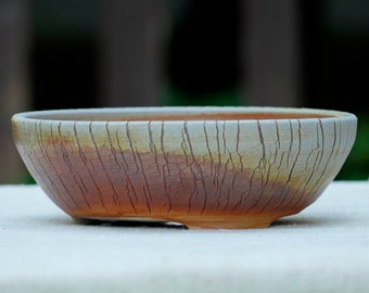 Hand thrown stoneware wood-fired round bonsai pot with cracks