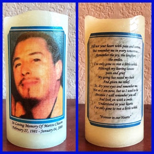 May include: A white pillar candle with a blue border and a photo of a man on one side. The other side has a poem about remembering a loved one. The text reads "In Loving Memory of Marcos Chacon February 27, 1981 - January 04, 2008" and "Forever in our Hearts".