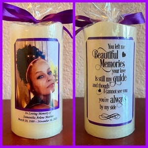 May include: A white pillar candle with a purple ribbon and a photo of a young woman on one side. The other side has the text "You left me Beautiful Memories your love is still my guide and though I cannot see you you're always by my side".