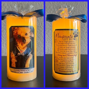 May include: A yellow candle with a photo of a dog and the text "In Loving Memory of MAX September 19, 2006 - October 4, 2022". The other side of the candle has the text "Pawprints Left By You..." and a poem about a pet.