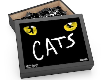 May include: A black puzzle box with the word "CATS" in white, and yellow cat eyes. The box is open, revealing black and white puzzle pieces. The box reads "11x14 Puzzle 252 pcs Ages 9+".