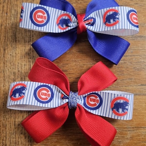 May include: A set of three ceramic mugs with a speckled, matte finish. The mugs are in shades of cream, light gray, and dark gray. Each mug has a simple, minimalist design and a rounded handle.