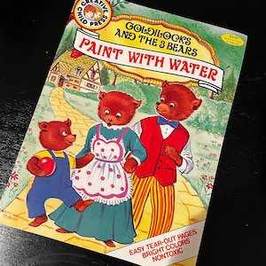 Goldilocks and three bears paint with water book by child