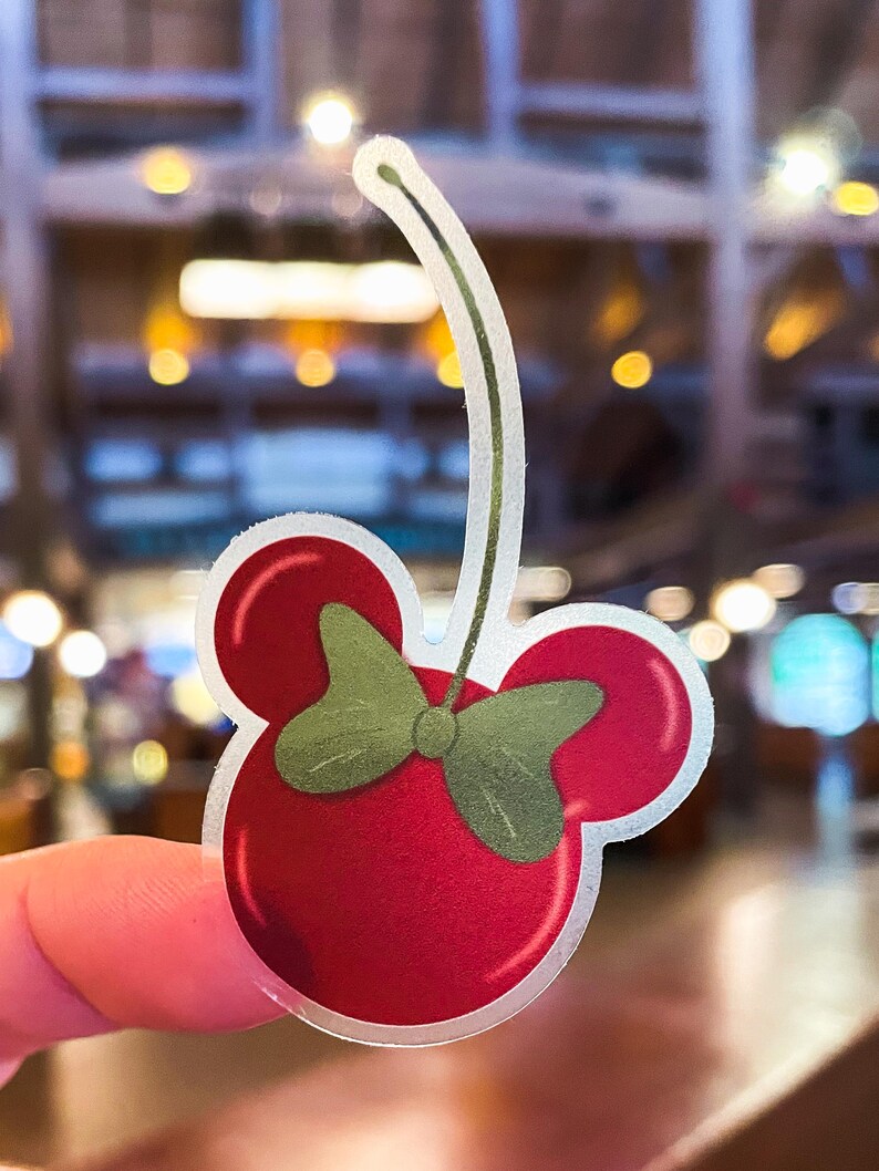 Minnie Mouse stickers of a dark red cherry shaped like Minnie, part of a Disney stickers collection that includes waterproof outdoor stickers.