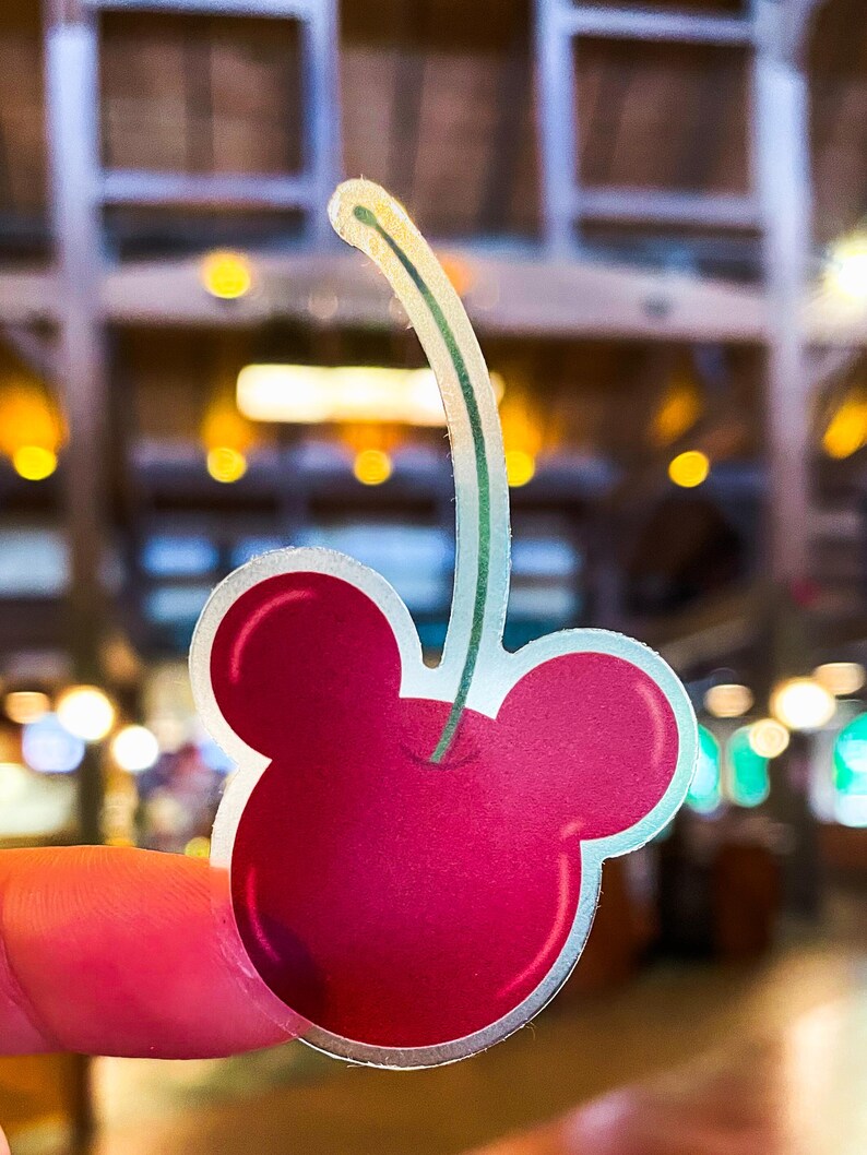 Mickey Mouse stickers of a dark red cherry shaped like Mickey, part of a Disney stickers collection that includes waterproof outdoor stickers.