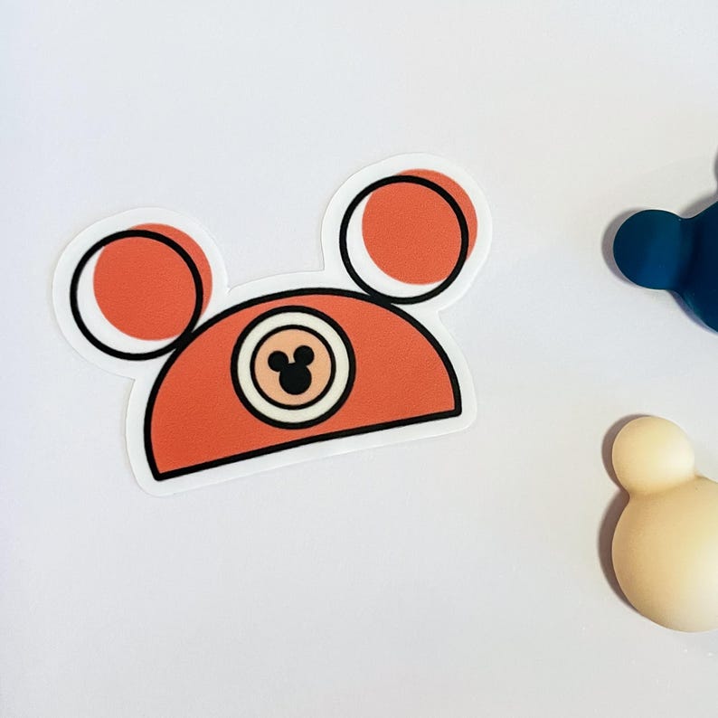 A waterproof vinyl Mickey hat sticker in and orange-rust color, one of a collection of Disney stickers for water bottles.