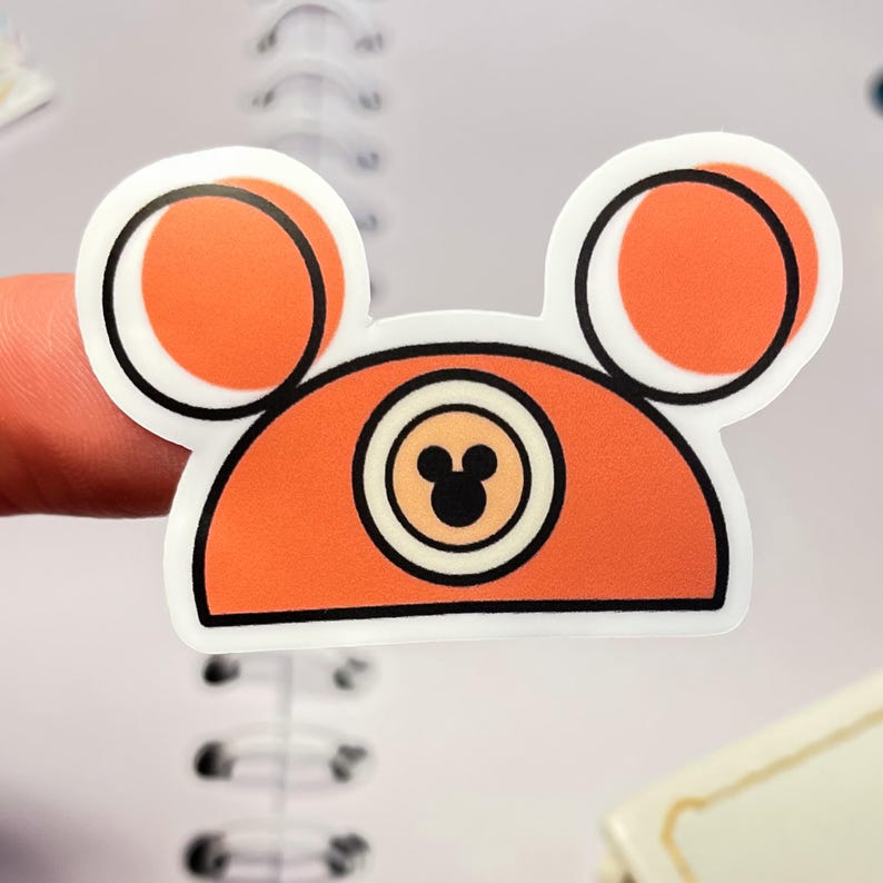 A waterproof vinyl Mickey hat sticker in and orange-rust color, one of a collection of Disney stickers for water bottles.