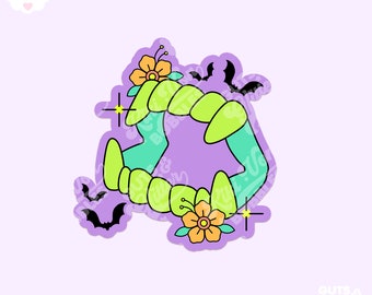 May include: A green and yellow monster mouth with fangs, surrounded by purple, orange, and yellow flowers and black bats. The background is a light purple color.