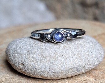 Sterling Silver Leaf Wound Ring set with a Sapphire