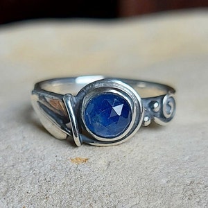 Hand Made Sterling Silver Leaf Band set with a Hand Cut Sapphire