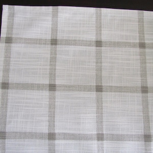 May include: White fabric with a subtle texture and a brown checkered pattern.