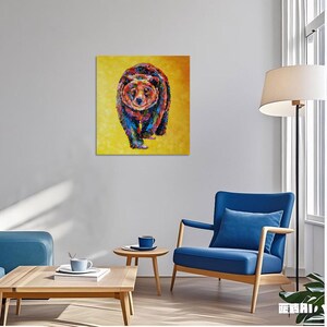 May include: A colorful painting of a bear walking forward, set against a yellow background. The bear is depicted with a mosaic of vibrant colors, including blue, red, green, and orange. The artwork is square and mounted on a wall.