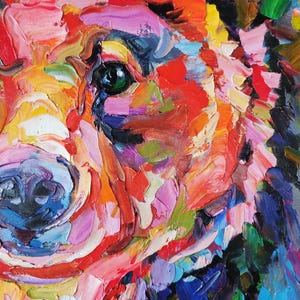May include: Close-up of a colorful oil painting of a dog's face. The artwork features thick brushstrokes in shades of red, orange, yellow, green, blue, and purple. The dog's eye is a striking green.