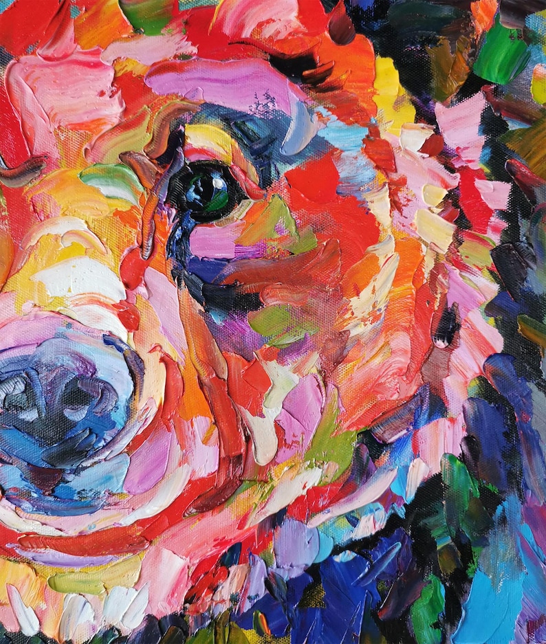 May include: Close-up of a colorful oil painting of a dog's face. The artwork features thick brushstrokes in shades of red, orange, yellow, green, blue, and purple. The dog's eye is a striking green.