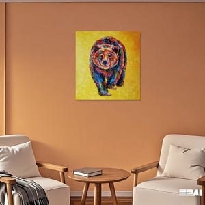 May include: A colorful painting of a bear walking forward, set against a yellow background. The bear is depicted with a vibrant mix of blues, reds, greens, and yellows, creating a textured, artistic effect. The artwork is a square canvas.