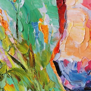 May include: Close-up of an abstract oil painting with thick brushstrokes. The artwork features a vibrant palette of colors, including green, orange, red, yellow, and blue. The textured surface creates a sense of depth and movement, suggesting a floral or landscape theme.