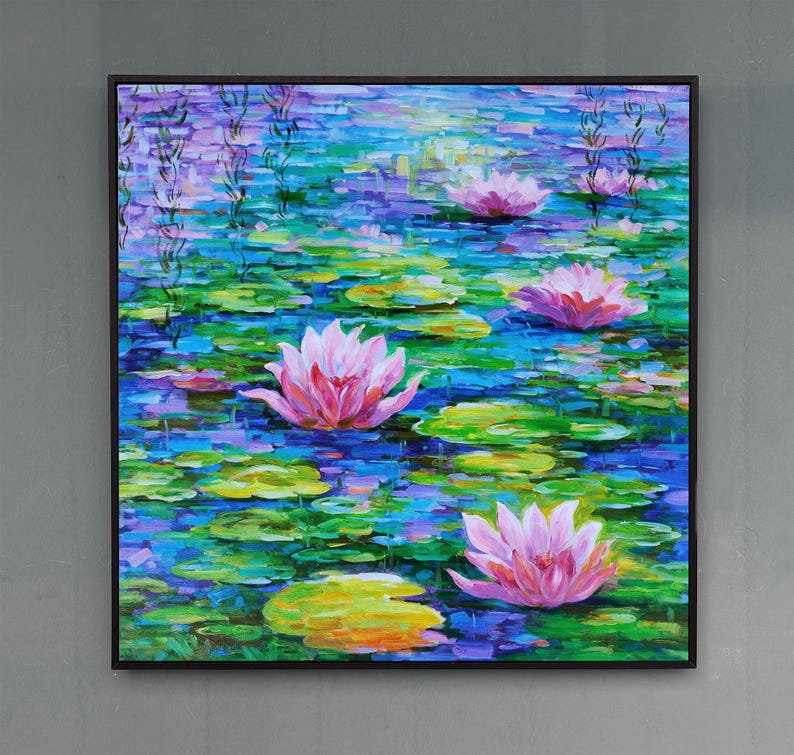 May include: Square framed oil painting of a pond scene with pink water lilies and lily pads. The water is a mix of blues and greens, with the lilies in full bloom. The painting has a textured, impressionistic style.