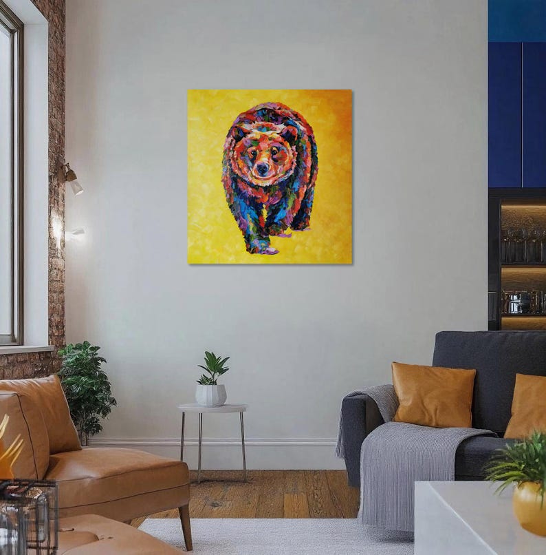 May include: A colorful painting of a bear walking forward, set against a yellow background. The bear is depicted with a mosaic of vibrant colors, including red, blue, green, and orange. The artwork is displayed on a square canvas.