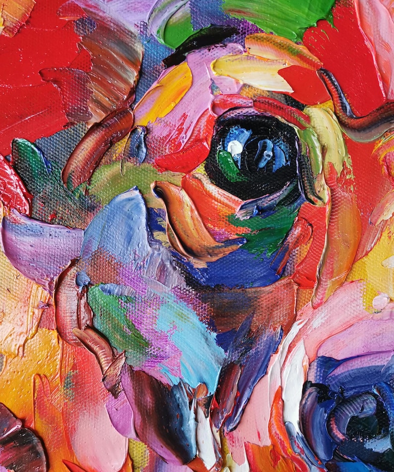 May include: Close-up of a colorful impasto painting of a dog's face. The artwork features thick brushstrokes in shades of red, blue, green, yellow, and pink, creating a textured and vibrant effect. The dog's eye is a focal point.