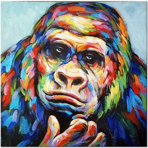 May include: A colorful abstract painting of a gorilla's face. The gorilla's face is painted in a variety of bright colors, including blue, green, yellow, and red. The gorilla's eyes are large and dark, and its mouth is slightly open. The painting is done in a style that is both realistic and abstract.