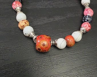 Red, black, and white bracelet